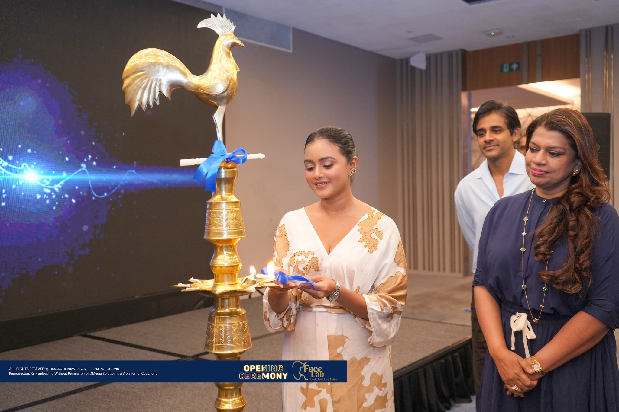 Lighting the ceremonial oil lamp at the FaceLab opening